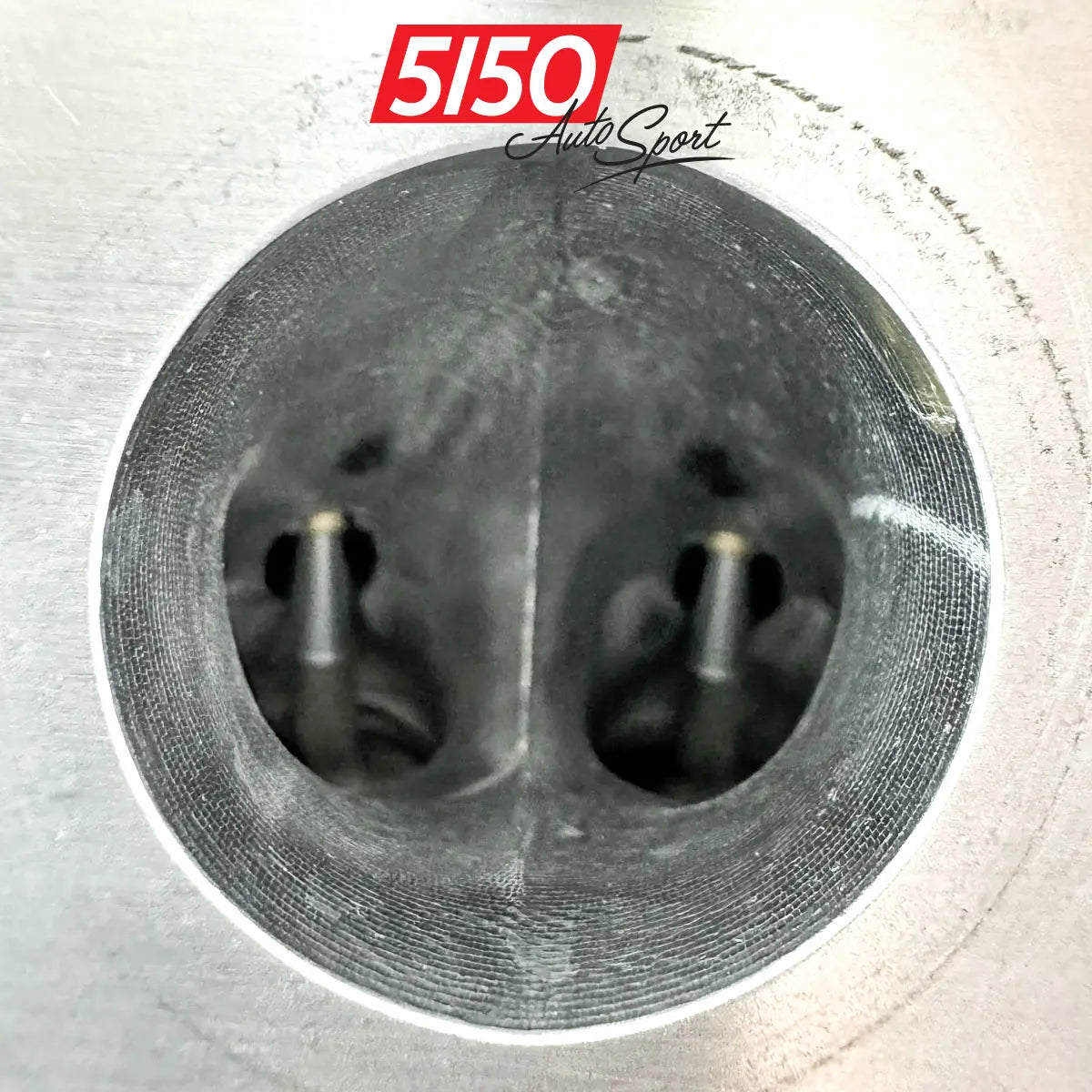 Detailed photo of BMW N55 cylinder head with improved ports thanks to CNC machining